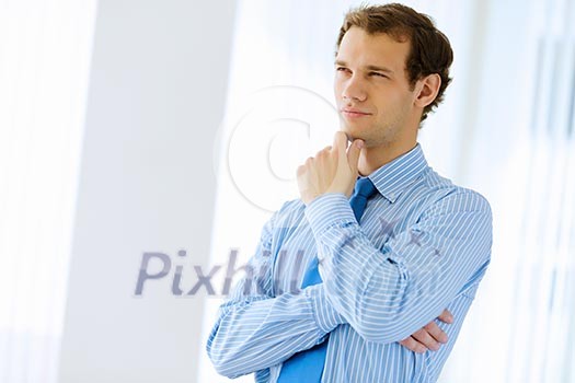 Image of young handsome confident businessman in suit Image of young handsome confident businessman in suit