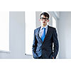 Image of handsome confident businessman in glasses