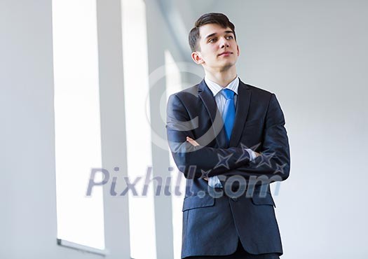 Image of handsome confident businessman in business suit