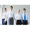 Image of four businesspeople standing in row. Partnership concept
