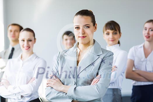 Young business people standing with arms crossed on chest Young business people standing with arms crossed on chest
