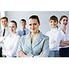 Young business people standing with arms crossed on chest