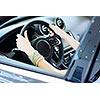 Close up of woman hands driving a car