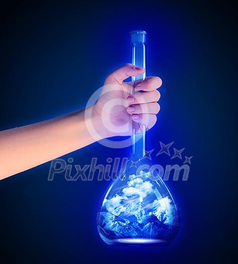 Close up image of human hand with test tube Close up image of human hand with test tube