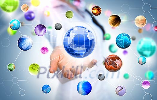 Close up of human hand holding globe image Close up of human hand holding globe image