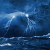 Image of night stormy sea with big waves and lightning