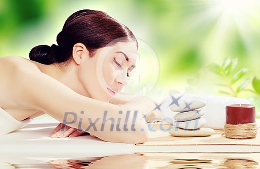 Young pretty woman with clear skin at spa salon getting massage Young pretty woman with clear skin at spa salon getting massage