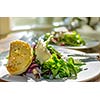 A plate of salad and garlic bread