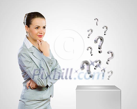 Image of concentrated businesswoman looking for answer Image of concentrated businesswoman looking for answer