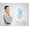 Image of thoughtful businesswoman looking at gears. Business structure