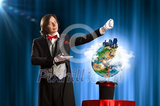 Image of wizard showing tricks with his hat. Ecology concept. Elements of this image are furnished by NASA Image of wizard showing tricks with his hat. Ecology concept. Elements of this image are furnished by NASA