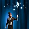 Image of man magician with balloon against color background