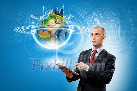 Image of businessman with tablet pc. Elements of this image are furnished by NASA