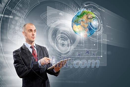 Image of businessman with tablet pc. Elements of this image are furnished by NASA Image of businessman with tablet pc. Elements of this image are furnished by NASA
