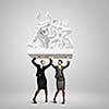 Image of two businesswomen holding burden above head