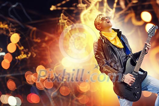 Young man, rock musician in jacket playing guitar Young man, rock musician in jacket playing guitar