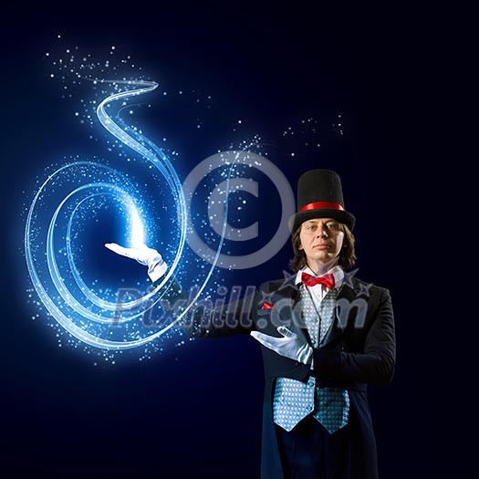 Image of wizard in red bow tie showing tricks Image of wizard in red bow tie showing tricks