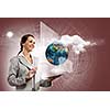 Young businesswoman with tablet pc in hands. Globalization concept. Elements of this image are furnished by NASA