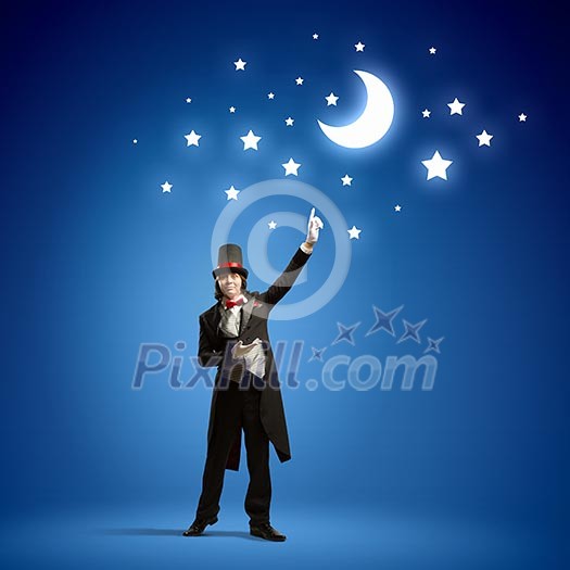 Image of man magician against color background