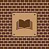 book symbols on brick wall 