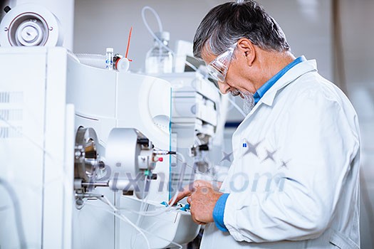 Senior male researcher carrying out scientific research in a lab (shallow DOF; color toned image) Senior male researcher carrying out scientific research in a lab (shallow DOF; color toned image)