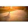 Male athlete/runner running on road - jog workout well-being concept