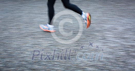 Motion blurred runner's feet in a city environment (panning technique used -> motion blurred image; color toned image) Motion blurred runner's feet in a city environment (panning technique used -> motion blurred image; color toned image)