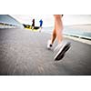 Young woman jogging outdoors (motion blurred image)