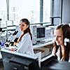 Two young researchers carrying out experiments in a lab (shallow DOF; color toned image)