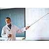 Senior chemistry professor giving a lecture in front of classroom full of students (shallow DOF; color toned image)