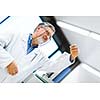 Senior male researcher carrying out scientific research in a lab (shallow DOF; color toned image)
