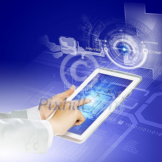 Close up image of human hand touching screen of tablet pc