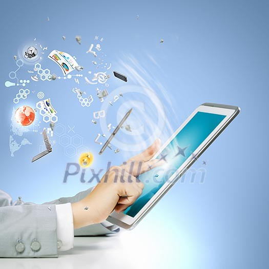 Close up image of human hand touching screen of tablet pc