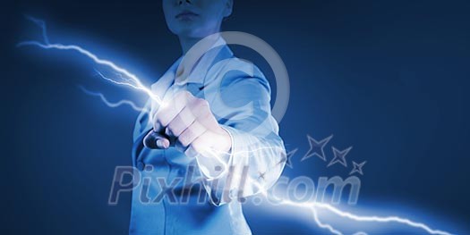 Image of powerful businesswoman holding lightning in fist