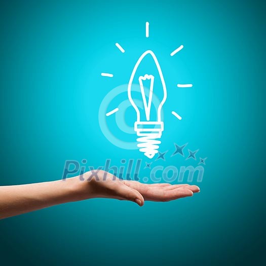 Close up image of human hand with drawn electrical bulb Close up image of human hand with drawn electrical bulb