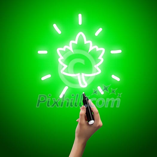 Close up of human hand drawing maple leaf Close up of human hand drawing maple leaf