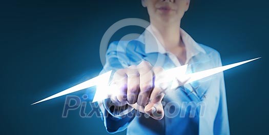 Image of powerful businesswoman holding lightning in fist