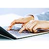 Close up image of businesswoman hands typing on keyboard