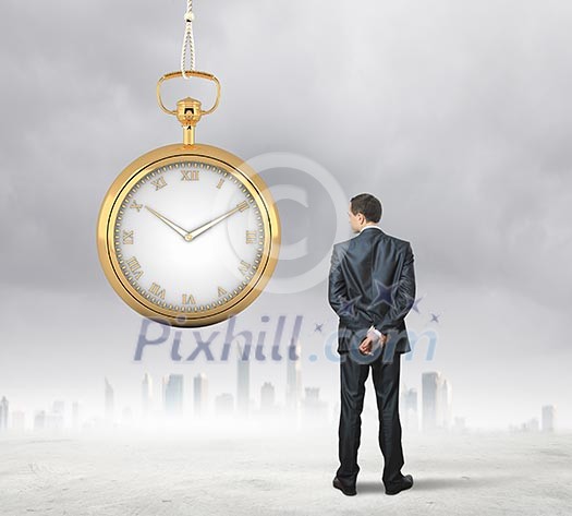 Image of young businessman and pocket watch. Time concept Image of young businessman and pocket watch. Time concept
