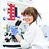 Portrait of a female researcher doing research in a lab (shallow DOF; color toned image)