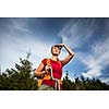 Pretty, female hiker going downhill in warm evening light