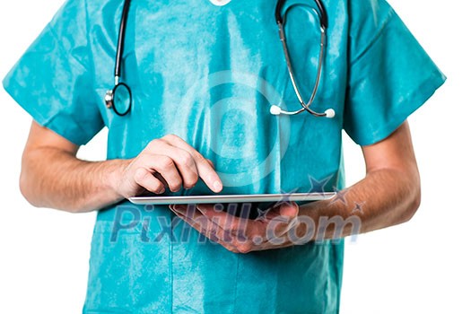 Young doctor using a tablet computer at work (color toned image)