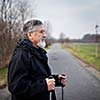 Senior man nordic walking, enjoying the outdoors, the fresh air, getting the necessary exercise