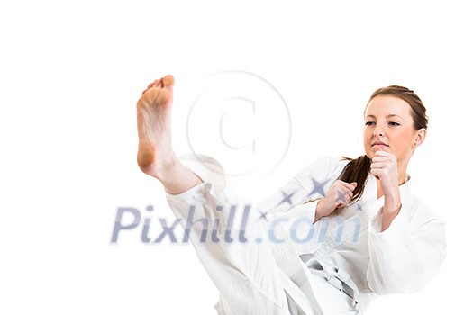 Beautiful caucasian, young, woman makes a kick in karate kimono on white background Beautiful caucasian, young, woman makes a kick in karate kimono on white background