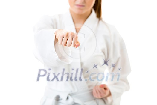 Beautiful caucasian, young, woman performing karate moves on white background