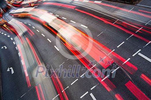 Motion blurred city road traffic (color toned  image)