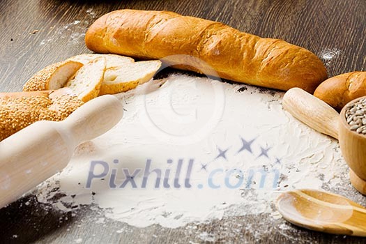 White bread and flour on kitchen table White bread and flour on kitchen table