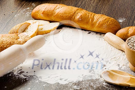 White bread and flour on kitchen table