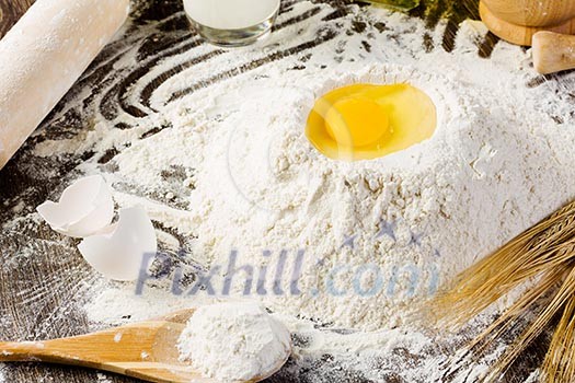 White bread drought and flour on kitchen table White bread drought and flour on kitchen table