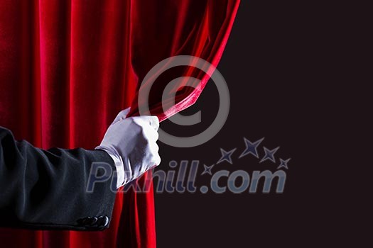 Close up of hand in white glove open the curtain. Place for text